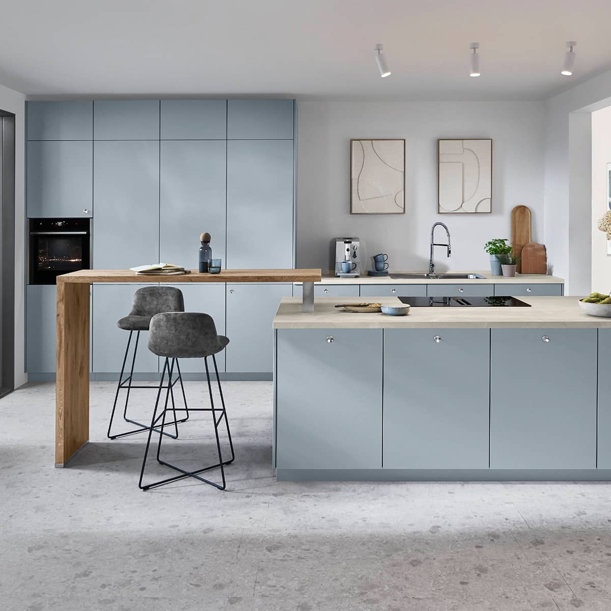 Senso Kitchen 485 - Blue Kitchen with suspended breakfast bench Light blue modern kitchen island with a cantilevered wooden breakfast bar and matching handleless cabinets.