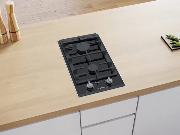 Bosch PRB3A6B70 Domino Gas Hob in black ceramic, featuring FlameSelect, ergonomic sword knobs, and cast-iron pan supports.