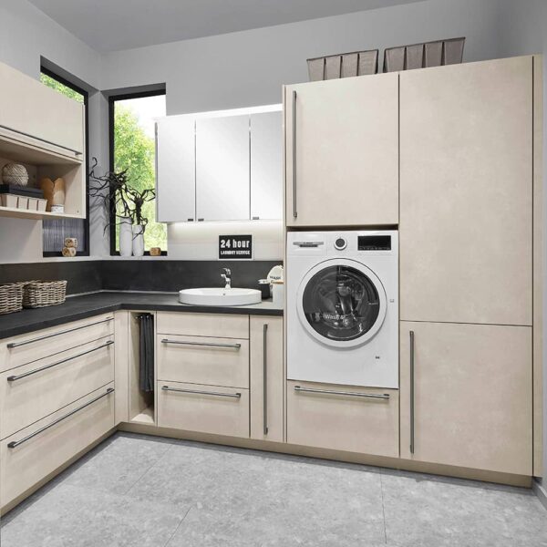Beige Laundry room with dark work top and handles