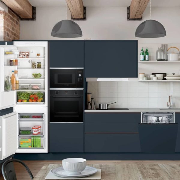 A collection of six premium kitchen appliances including a fridge freezer, oven, microwave, ceramic hob, dishwasher, and built-in hood, all featured in a limited January Sale with a 5-year warranty on Bosch appliances.