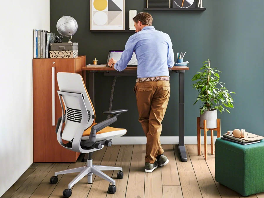 A sleek, modern standing desk with adjustable height settings, designed to promote better posture and ergonomic comfort during work.