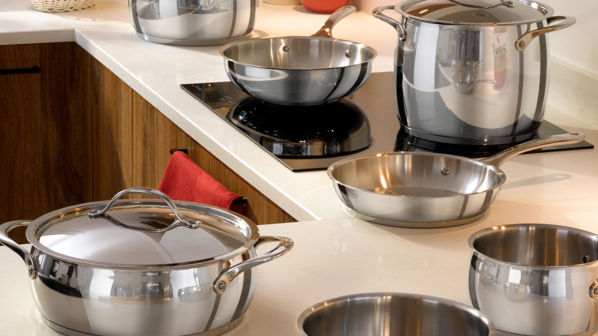 A set of high-quality Lagostina pots and pans on an induction hob