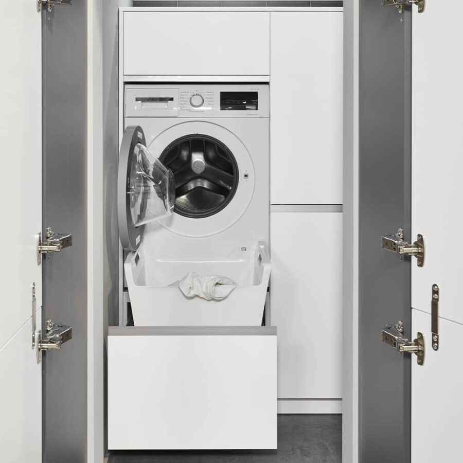 Elevated washing machine in hidden unit