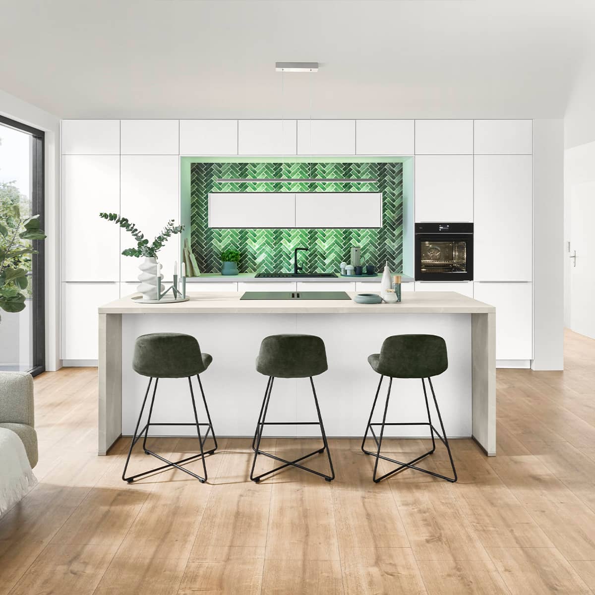 Modern Nobilia Softline 507 kitchen featuring white cabinetry, a central island and a striking green patterned backsplash.