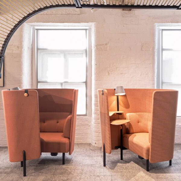 Orangebox Diggs booth placed in a modern open-plan office setting with high-back acoustic panels.