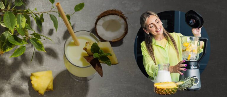 A creamy Piña Colada cocktail served in a glass with pineapple garnish, made using a Bosch blender and fresh tropical ingredients.