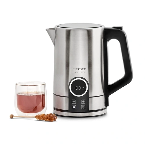 Caso WK 2200 stainless steel kettle beside a clear glass filled with brown liquid, likely tea, on white background.