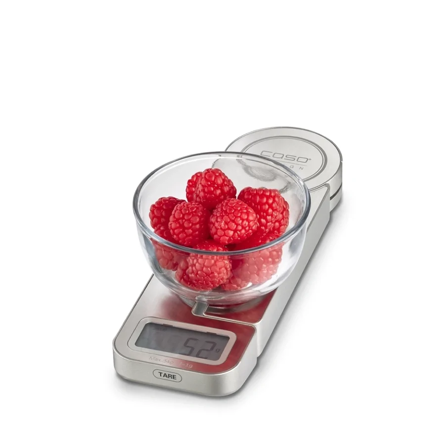 caso stainless steel scale on white background with a jar of fruits on top of it