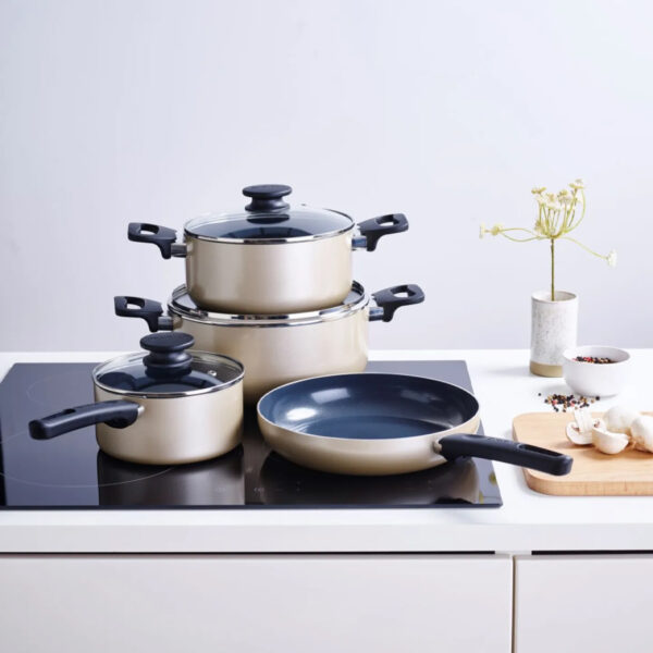 Brabantia Ready 2 Cook 4-piece cookware set on induction hob in modern white kitchen lifestyle environment.