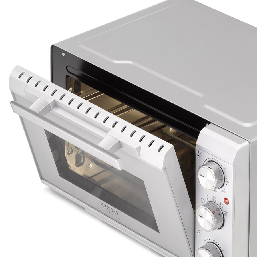 CASO TO 20 Silver Oven with door slightly open, interior lights on, ventilation slots visible on the door.