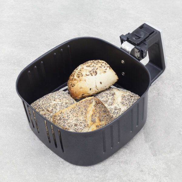 Basket of Caso Air Fry AF 255 filled with bread pieces, showing crisp texture and golden color