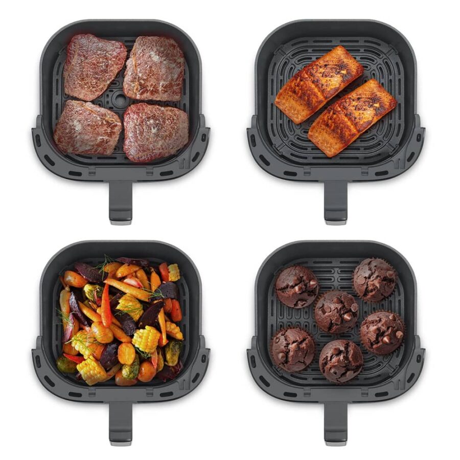 Top view of four Caso AirFry 6.0 baskets with beef, salmon, chocolate muffins, and mixed vegetables including corn and carrots