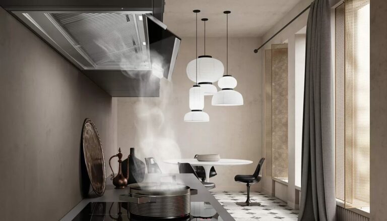 Steam rising from a cooking pot and being drawn into a Faber InNova kitchen hood.