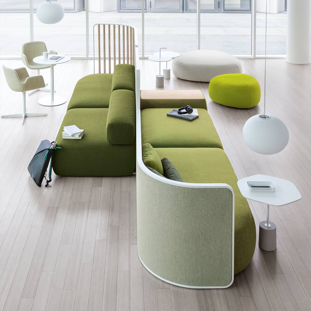 Back to back green sofa with partition.