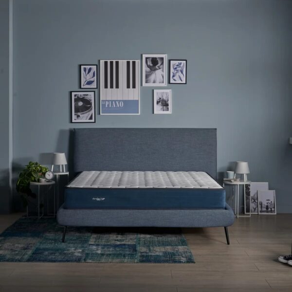 Dorelan mattress with blue band on bed