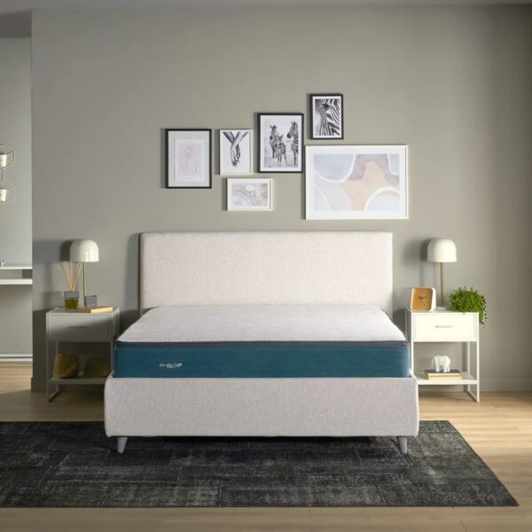 Venus Mattress iwth blue band on white bed.