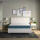 Venus Mattress iwth blue band on white bed.