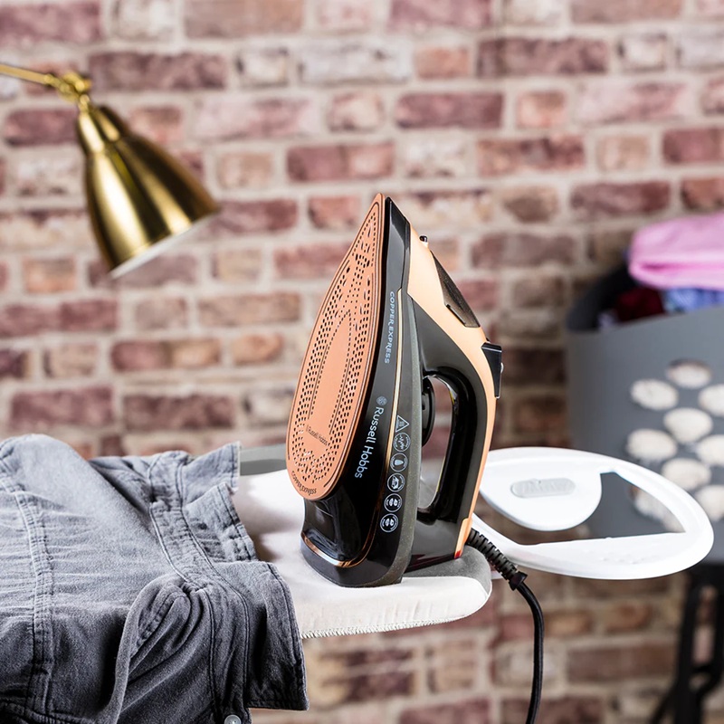 Russell Hobbs Copper Iron 23975-56 Lifestyle Black and copper iron on ironing board