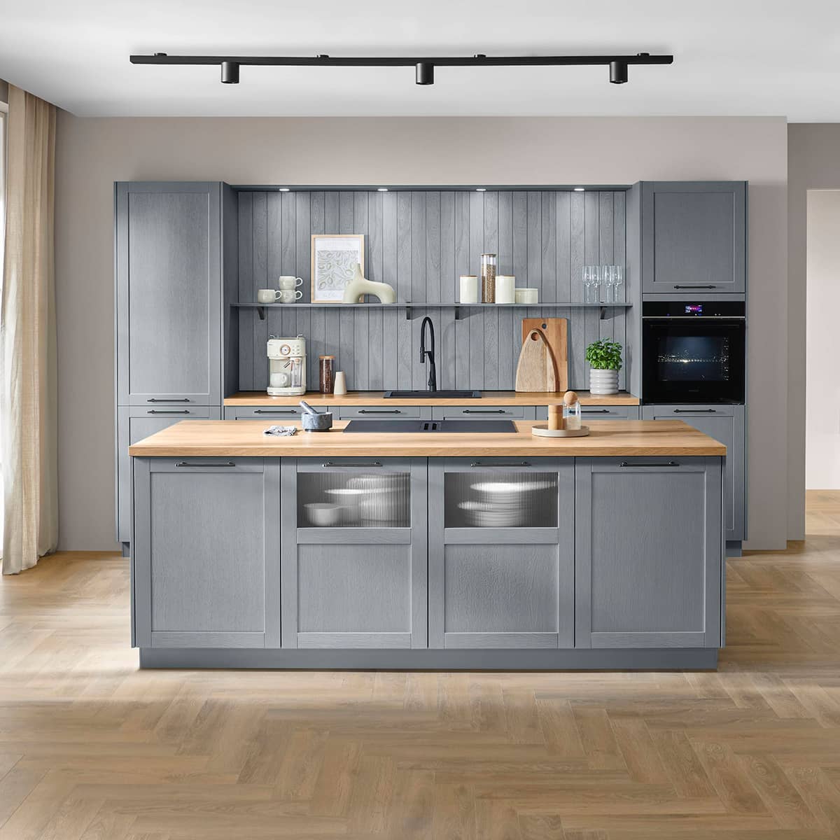 Stone blue Nobilia Frame kitchen with wood countertop and central island
